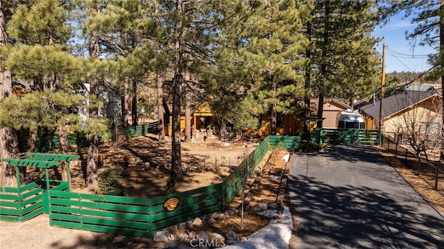 view of home's community with fence