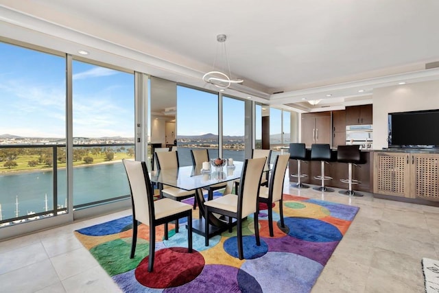 dining area featuring a wealth of natural light, a chandelier, and floor to ceiling windows