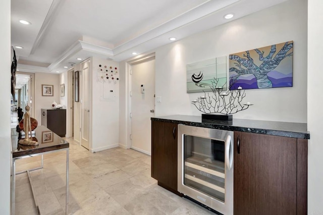 kitchen with dark brown cabinetry, recessed lighting, and beverage cooler