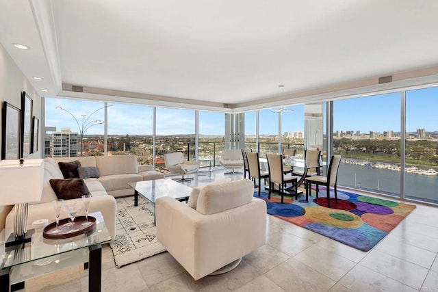 living room with recessed lighting, a view of city, floor to ceiling windows, and tile patterned flooring