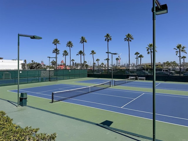 view of sport court with community basketball court and fence