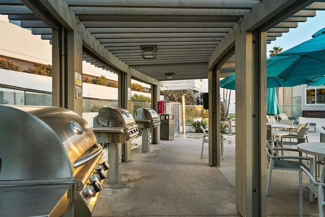 view of patio / terrace with an outdoor kitchen, a grill, outdoor dining space, and a pergola