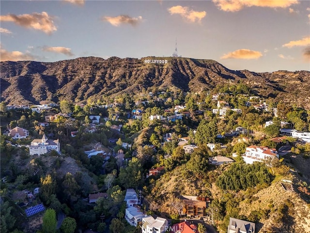 birds eye view of property with a mountain view