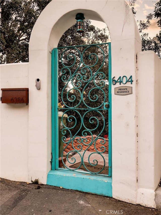 view of exterior entry with a gate