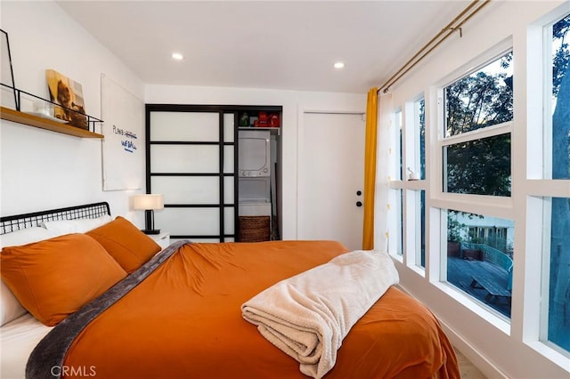 bedroom featuring recessed lighting and two closets