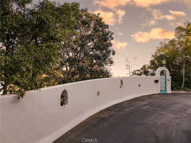 exterior space with a gate