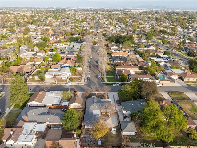 birds eye view of property with a residential view