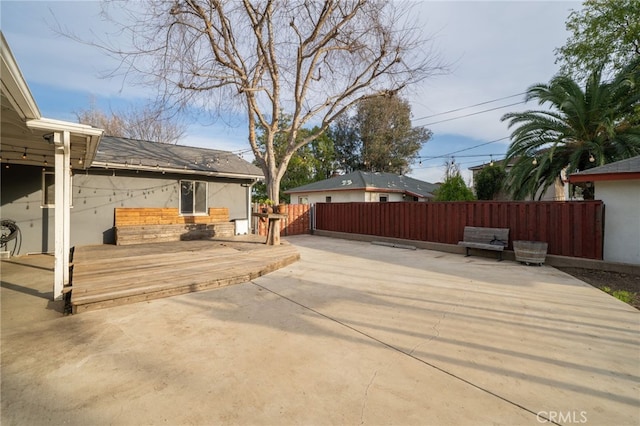 deck with a patio and fence