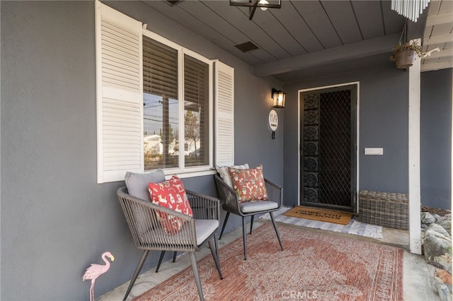 entrance to property with stucco siding