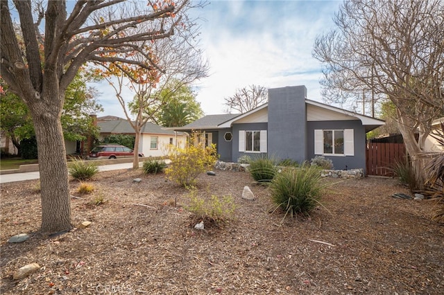 view of front of home with fence