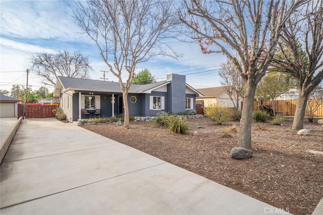 view of front of home with fence and stucco siding