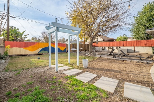 view of play area featuring a fenced backyard and a yard