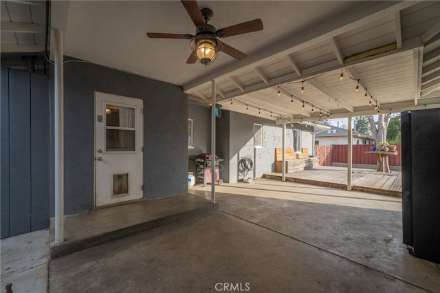 view of patio / terrace featuring ceiling fan and fence