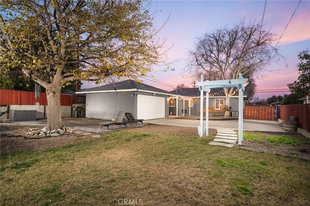 view of yard featuring fence, an outbuilding, a pergola, and a patio