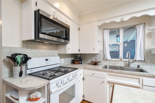 kitchen featuring open shelves, light countertops, and white range with gas stovetop