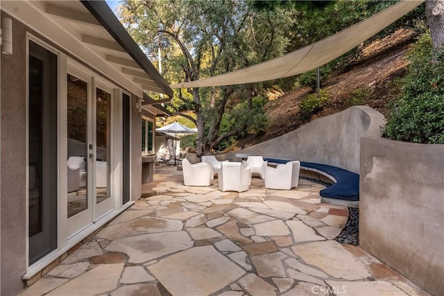 view of patio / terrace featuring french doors and outdoor dining area