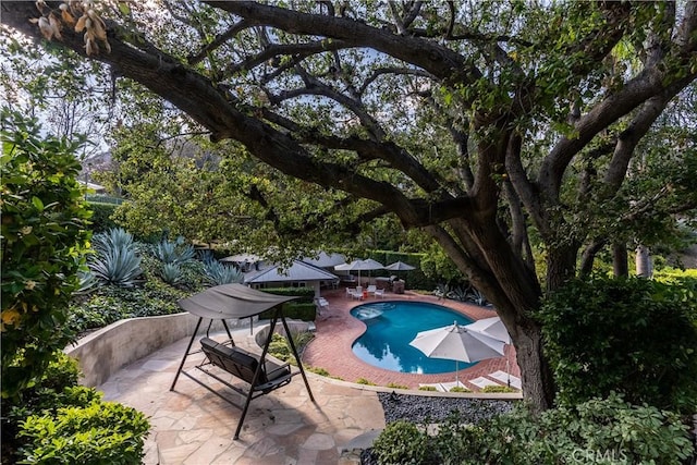 pool with a patio