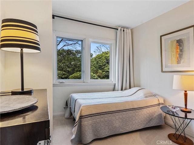 bedroom featuring baseboards