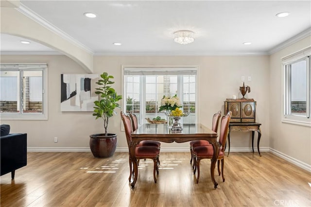 1632 Indus St, Newport Beach, CA 92660 - dining area featuring light wood-type flooring, baseboards, recessed lighting, crown molding, and arched walkways
