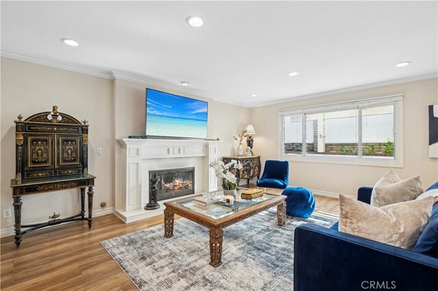 1632 Indus St, Newport Beach, CA 92660 - living room featuring wood finished floors, ornamental molding, recessed lighting, baseboards, and a glass covered fireplace