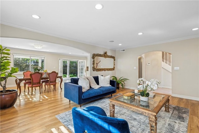 1632 Indus St, Newport Beach, CA 92660 - living room featuring arched walkways, light wood-style floors, recessed lighting, ornamental molding, and baseboards