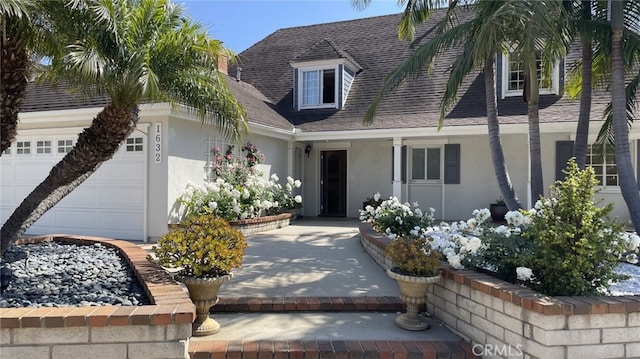 1632 Indus St, Newport Beach, CA 92660 - view of front facade with stucco siding, an attached garage, and a shingled roof