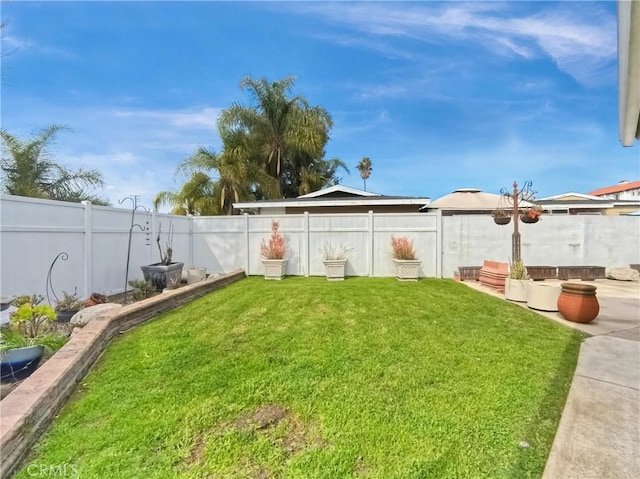 view of yard featuring a fenced backyard