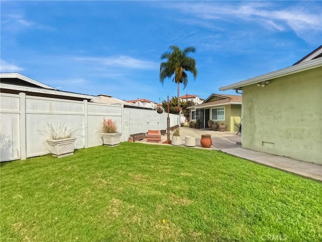 view of yard with a patio area and fence