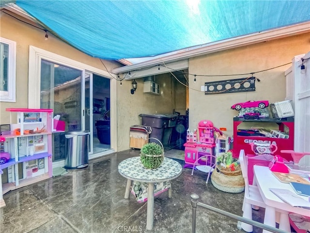 view of patio featuring a wall mounted AC