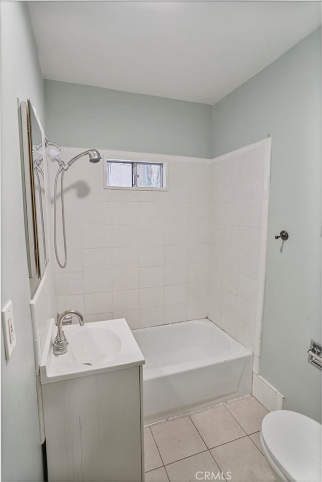 bathroom featuring shower / bath combination, vanity, toilet, and tile patterned floors