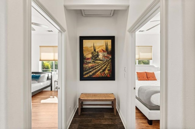 doorway to outside featuring dark wood-style floors, visible vents, and baseboards