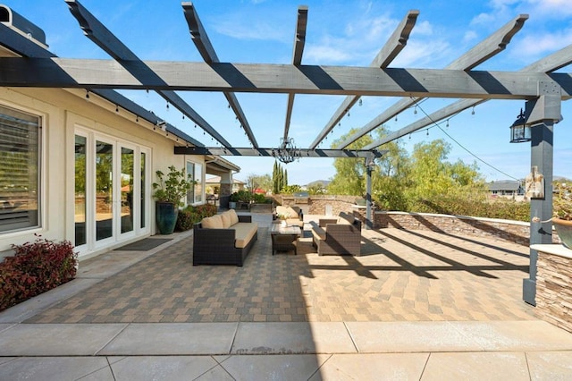 view of patio / terrace featuring french doors, an outdoor living space, and a pergola