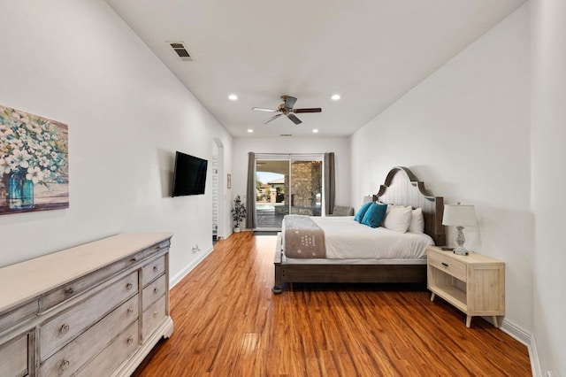 bedroom with access to exterior, light wood finished floors, recessed lighting, visible vents, and baseboards