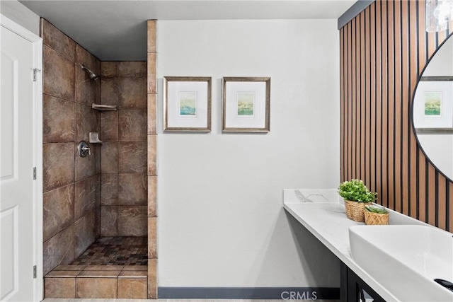 full bathroom featuring a sink and a walk in shower