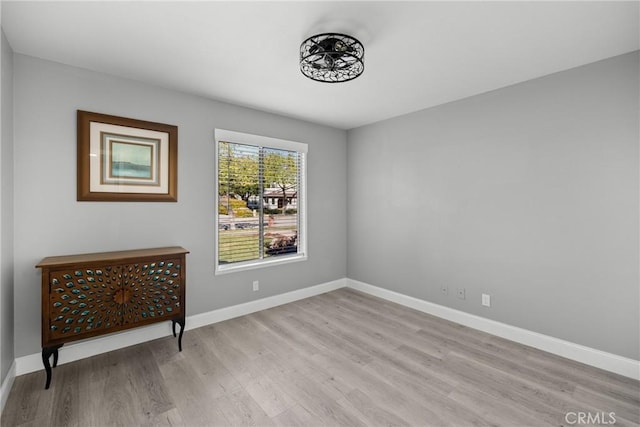 interior space with light wood-style floors and baseboards