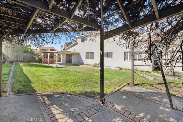 view of yard with fence and a patio