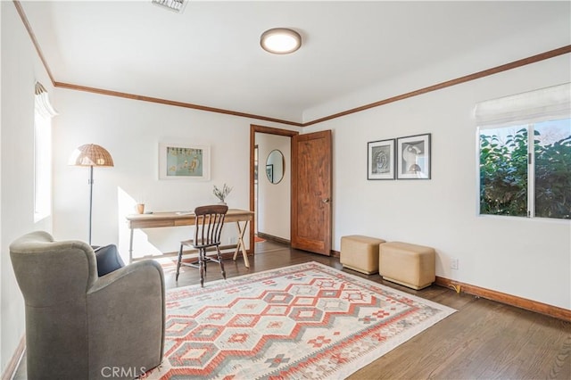 office area with ornamental molding, dark wood-style flooring, and baseboards