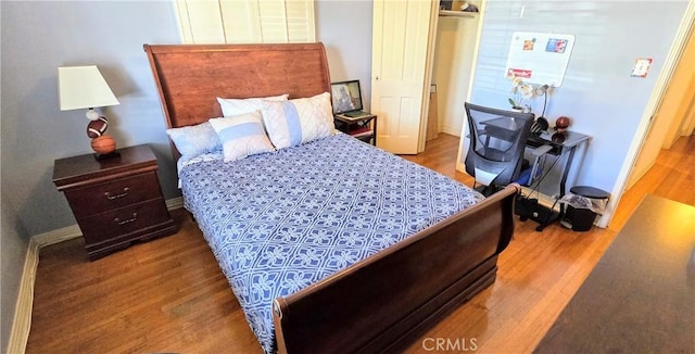 bedroom with wood finished floors