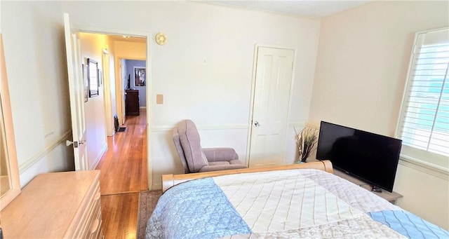 bedroom with a closet and wood finished floors