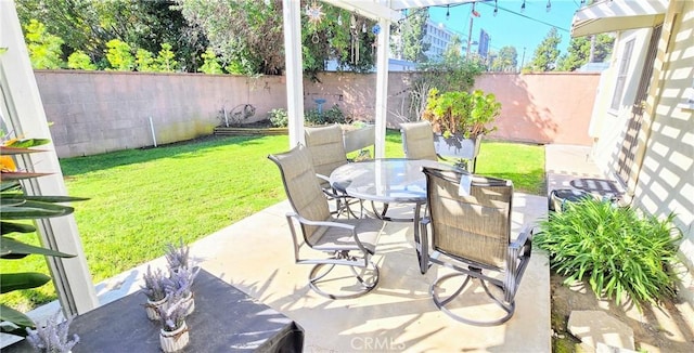 view of patio / terrace featuring outdoor dining area and a fenced backyard