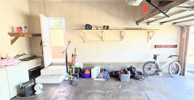 garage with washer / clothes dryer and a sink