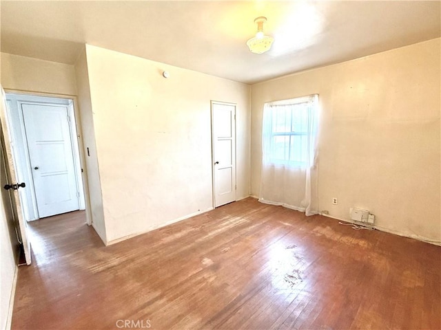 unfurnished room featuring wood finished floors