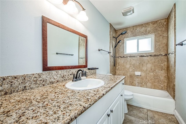 bathroom with toilet, tile patterned floors, washtub / shower combination, and vanity