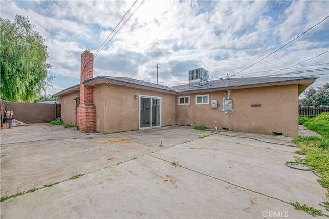 back of property featuring a patio area, fence, and stucco siding