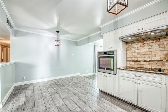 kitchen with decorative light fixtures, black electric stovetop, stainless steel oven, and white cabinetry