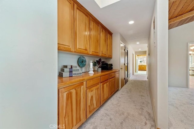 corridor with light carpet, wood ceiling, beam ceiling, and recessed lighting