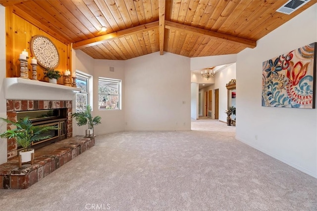 unfurnished living room featuring vaulted ceiling with beams, wooden ceiling, a fireplace, visible vents, and carpet