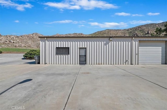 detached garage with a mountain view