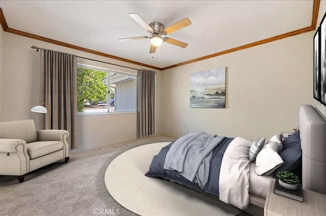 carpeted bedroom with ceiling fan and crown molding