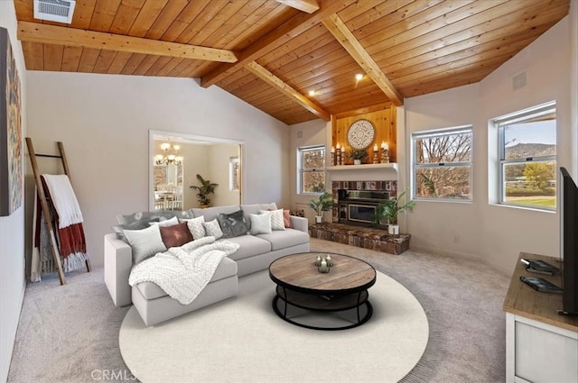 carpeted living area with vaulted ceiling with beams, wooden ceiling, visible vents, and a notable chandelier